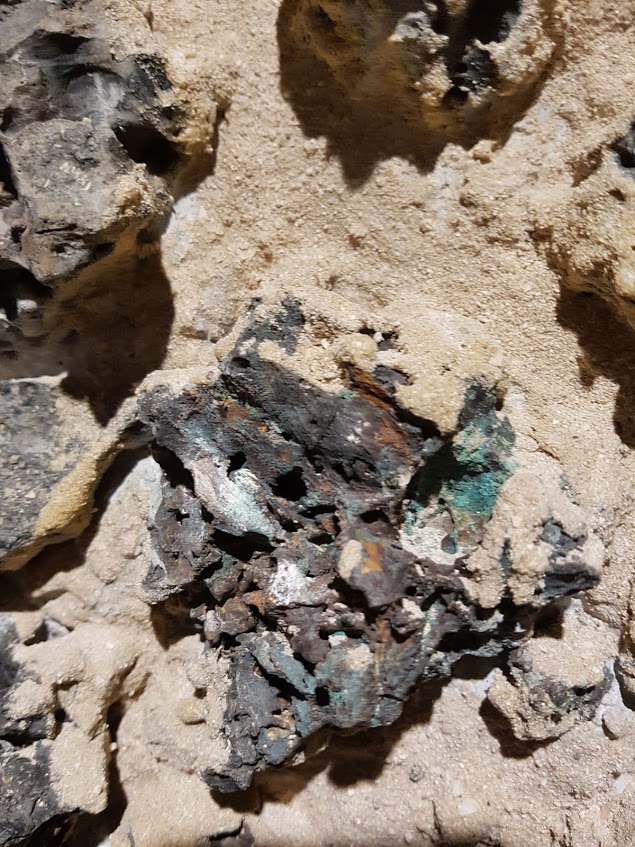 A lump of black copper slag from the surface of Saruq Al-Hadid